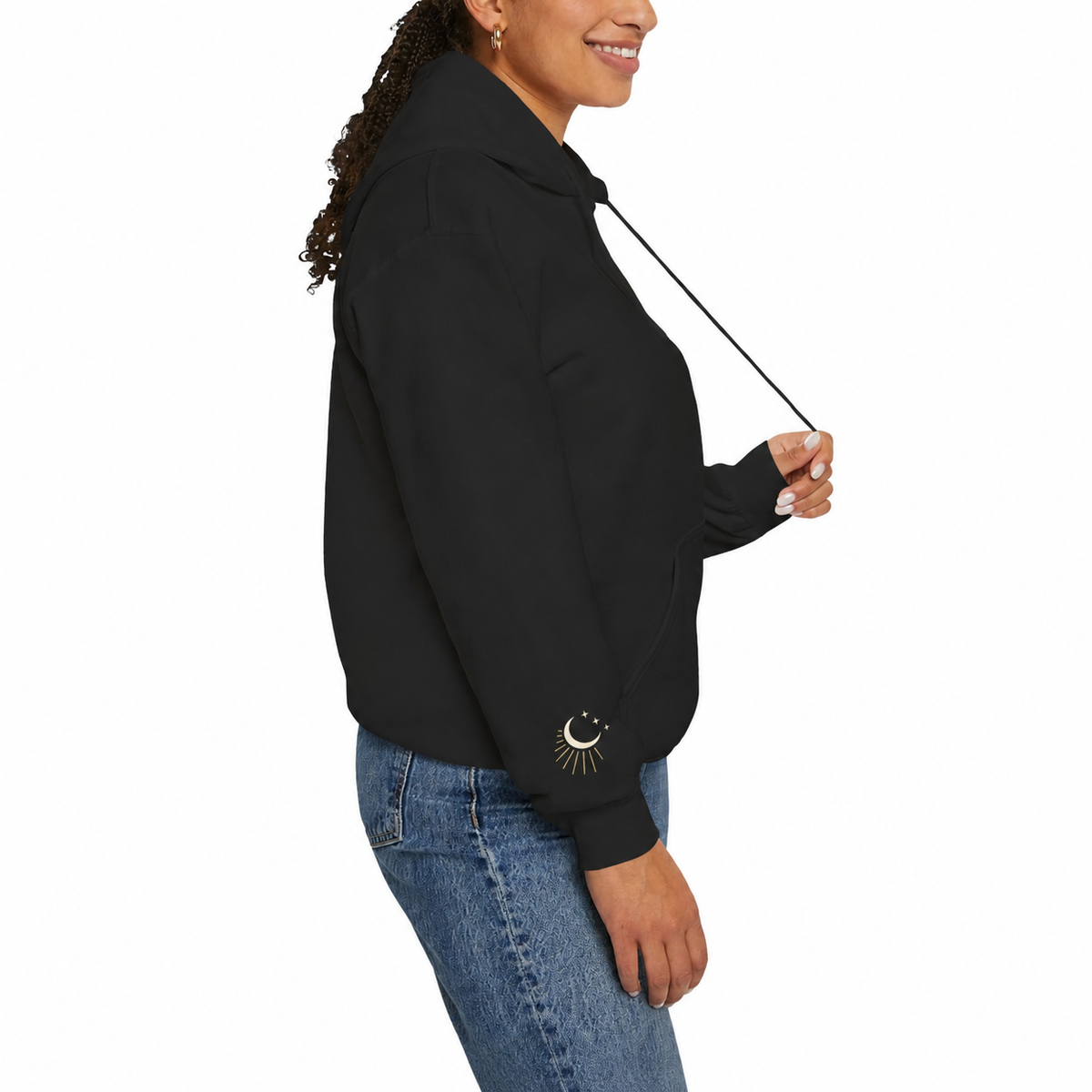 Model wearing the black After Report hoodie with the cream-and-gold celestial cuff detail visible
