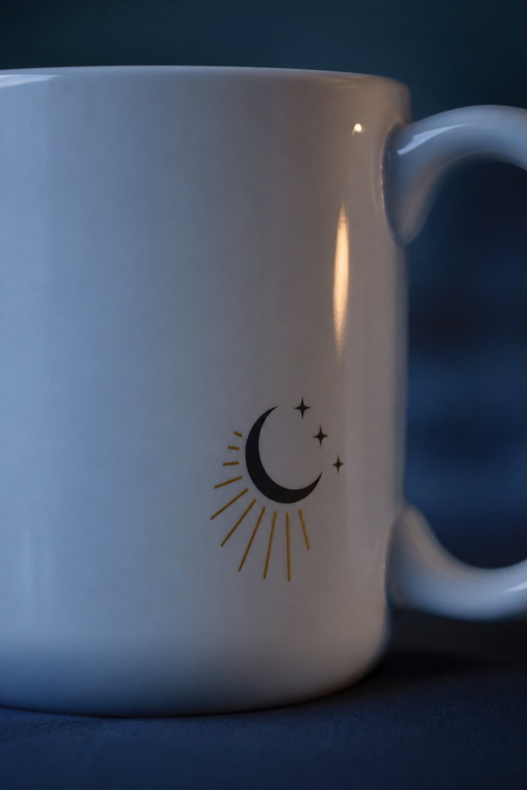 Close-up of the First Sip Signal celestial mark near the mug handle