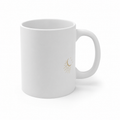 White 11 oz First Sip Signal mug with a small celestial mark beside the handle