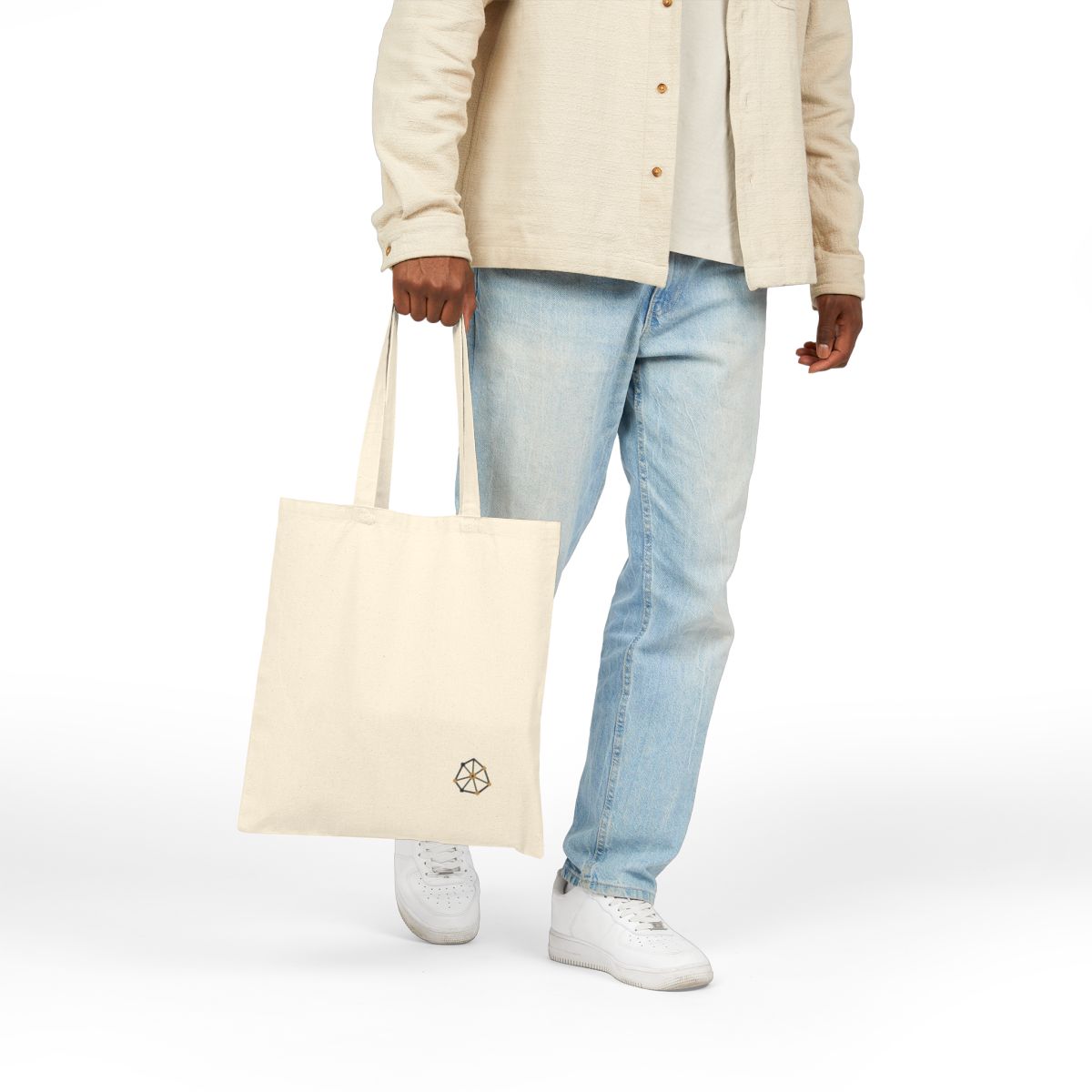 Model carrying the Unit Constellation canvas tote